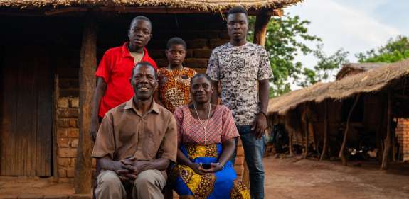 A family picture of a mum, dad, daughter and two brothers in Malawi